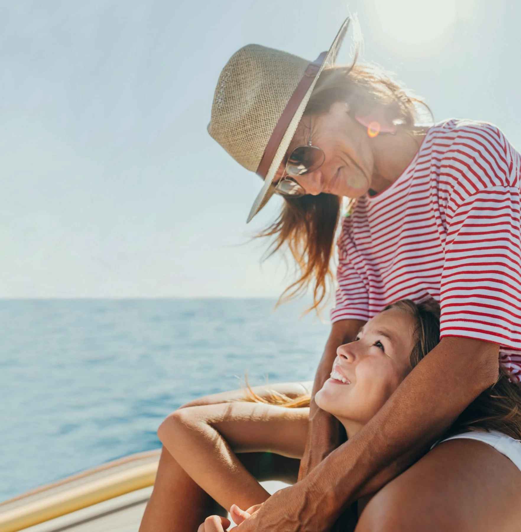 Family moment capturing the waterfront lifestyle of The Ritz-Carlton Residences, Estero Bay